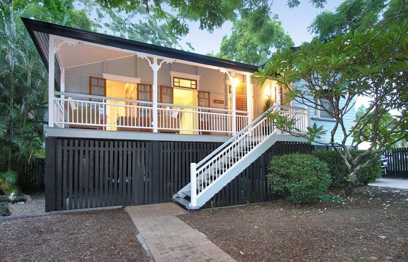 Red Brick Footpath On The Exterior Of Queenslander Leading To The Entrance Staircase To The Front Deck